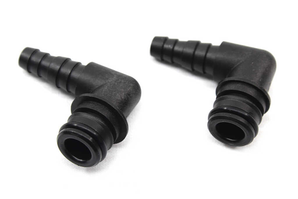 620720658: Fitting, 90 Degree, 3/8" x 1/2" Barb, X Port Flojet